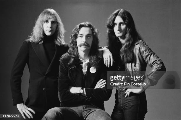 Guitarist Alex Lifeson, drummer Neil Peart and bassist and singer Geddy Lee), Canadian rock band, pose for a group studio portrait, 1978. The...