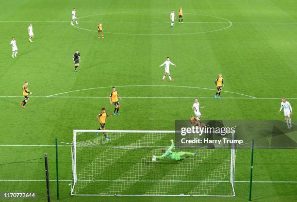 Barrie McKay of Swansea City has his shot saved by Callum Burton of Cambridge United during the Carabao Cup Second Round match between Swansea City...