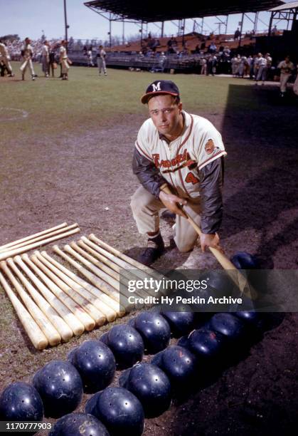 Eddie Mathews of the Milwaukee Braves poses for a portrait with helmets and baseball bats prior to an MLB Spring Training game circa March, 1958 in...