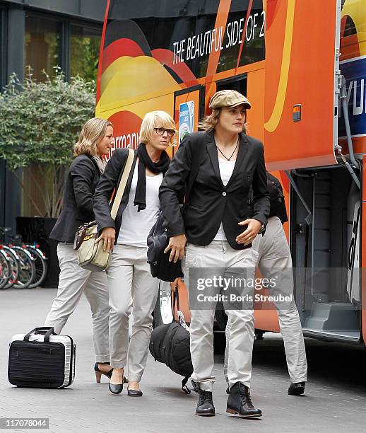 Nadine Angerer , Saskia Bartusiak and Inka Grings of the German Woman's National Football Team arrive at Hotel Esplanade on June 21, 2011 in Berlin,...