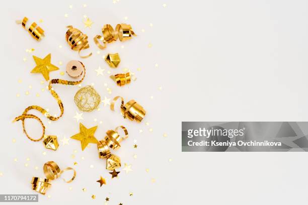 christmas composition. gift, christmas golden decorations, cypress branches, pine cones on white background. flat lay, top view - new year 2019 stock-fotos und bilder