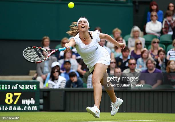 Aravane Rezai of France reaches for a shot during her first round match against Serena Williams of the United States on Day Two of the Wimbledon Lawn...