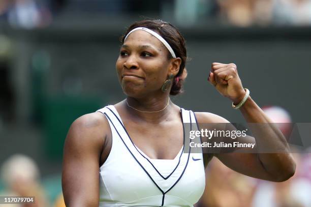 Serena Williams of the United States celebrates after winning her first round match against Aravane Rezai of France on Day Two of the Wimbledon Lawn...