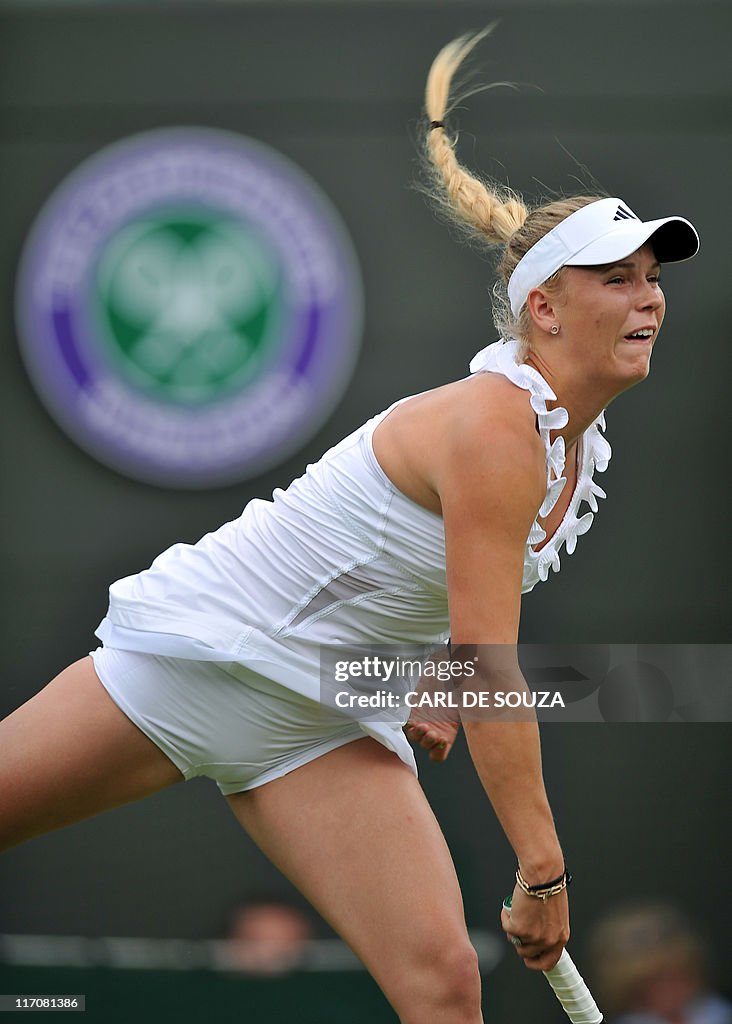 Danish player Caroline Wozniacki serves