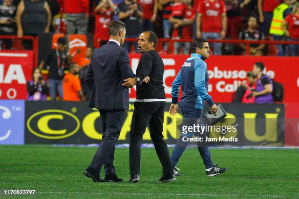 Pedro Caixinha, Head Coach of Cruz Azul greets Oscar Pareja, Head Coach of Tijuana during the 7th round match between Tijuana and Cruz Azul as part...