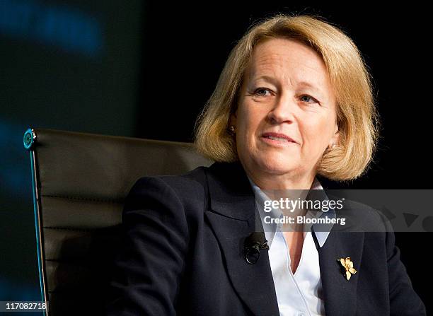 Mary Schapiro, chairman of the U.S. Securities and Exchange Commission, listens during the Wall Street Journal CFO Network conference in Washington,...