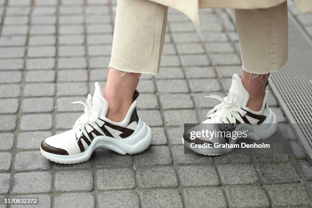 Aleisha Tanner wears a Topshop coat, Zara jeans, Louis Vuitton shoes and a Gucci bag during New Zealand Fashion Week 2019 on August 29, 2019 in...