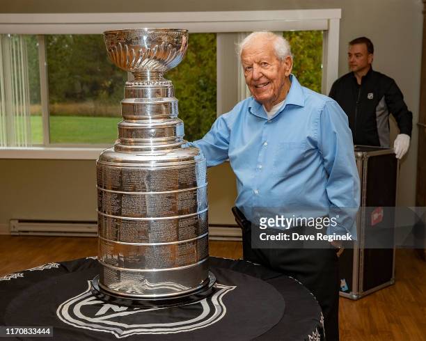 Residents of the Grandview Senior Home take pictures with the Stanley Cup prior to the Kraft Hockeyville game between the Detroit Red Wings and the...
