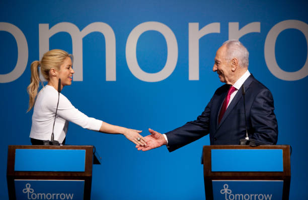 Israel's President Shimon Peres greets Colombian singer Shakira during a joint press conference on June 21, 2011 in Jerusalem, Israel. The pop star...