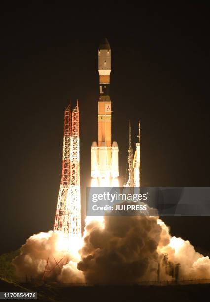 The H-IIB rocket with cargo vessel Kounotori8 is launched from the Japan Aerospace Exploration Agency's Tanegashima Space Center in southwestern...