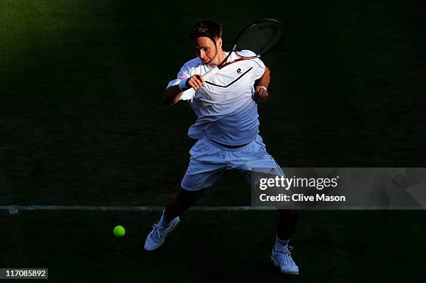 Robin Soderling of Sweden returns a shot during his first round match against Philipp Petzschner of Germany on Day Two of the Wimbledon Lawn Tennis...