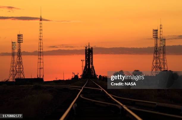 The Soyuz MS-15 spacecraft is seen on the launch pad in the early morning hours ahead of the scheduled launch with Expedition 61 crewmembers,...