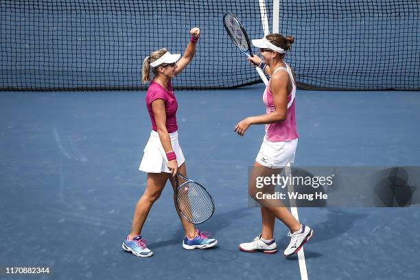 Nicoloe Melichar of USA and her partner Kveta Peschke of Czech celebrates wins the game after the match against Vania king of USA and Oksana...