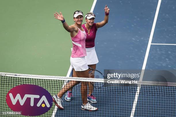 Nicoloe Melichar of USA and her partner Kveta Peschke of Czech celebrates wins the game after the match against Vania king of USA and Oksana...