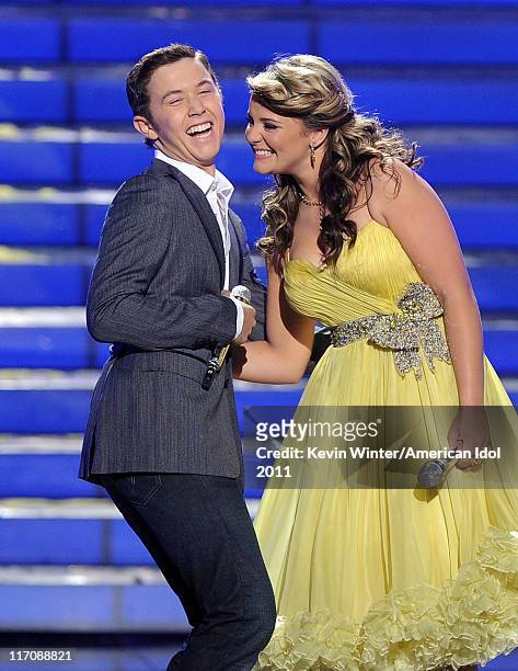 Finalists Scotty McCreery and Lauren Alaina await the final decision onstage during Fox's "American Idol 2011" finale results show held at Nokia...