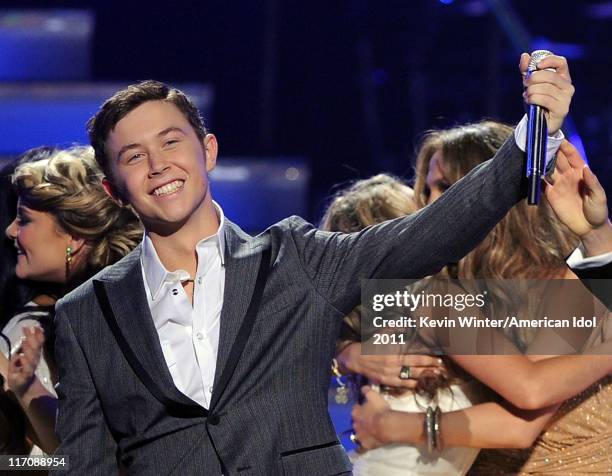 Singer Scotty McCreery is announced the American Idol for 2011 onstage performs onstage during Fox's "American Idol 2011" finale results show held at...