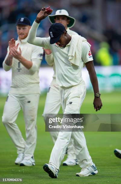 Jofra Archer of England holds the ball aloft as he walks back to the pavilion after taking six wickets during day one of the 3rd Ashes Test match...