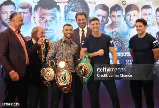 Vasiliy Lomachenko and Luke Campbell pose with the belts after speaking to the media during the Vasiliy Lomachenko and Luke Campbell press conference...