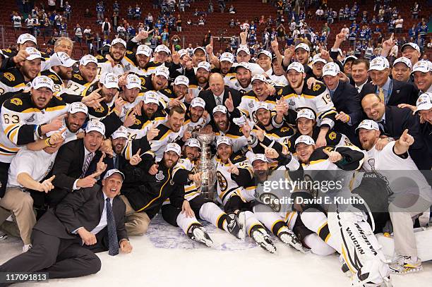 Team photo of Boston Bruins victorious with Stanley Cup trophy after win vs Vancouver Canucks at Rogers Arena. Game 7. Vancouver, Canada 6/15/2011...