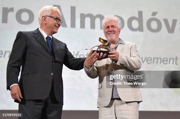 Paolo Baratta hands over the the Golden Lion Lifetime achievement award to Pedro Almodovar during the 76th Venice Film Festival at Sala Grande on...