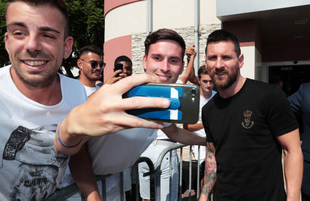 Champions League Forward of the Season 2018/19 Nominee, Lionel Messi of FC Barcelona poses for a selfie with a fan prior to the UEFA European Club...