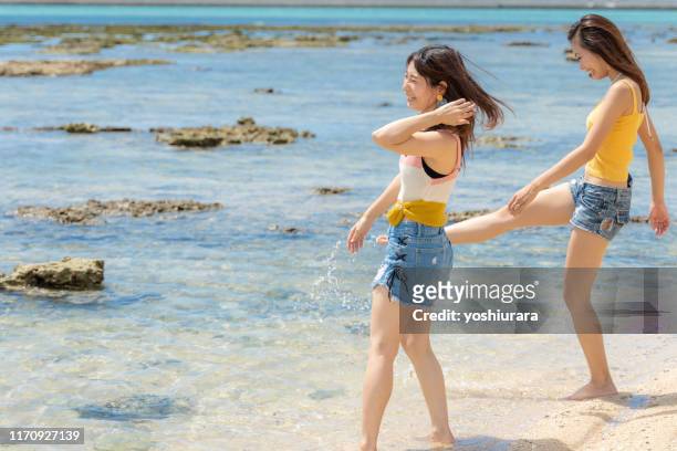 two women playing at a travel destination - only japanese stock pictures, royalty-free photos & images