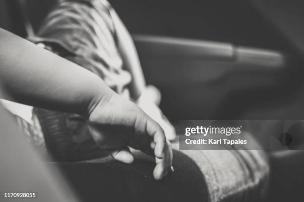 a close-up view of a toddler sleeping in the car - child mortality stock pictures, royalty-free photos & images