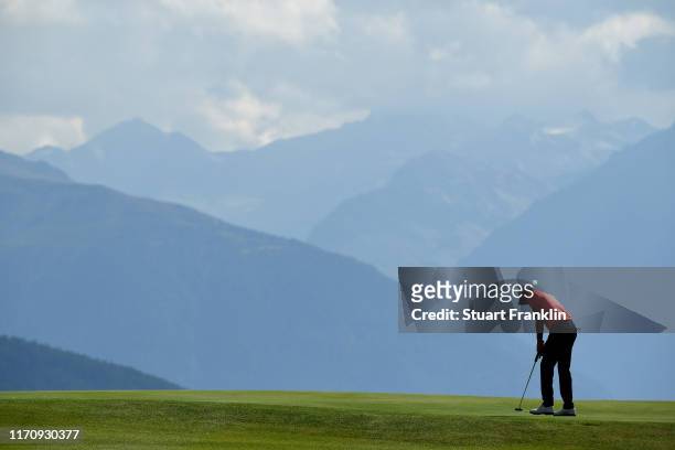 Benjamin Hebert of France putts on the seventh green during Day One of the Omega European Masters at Crans Montana Golf Club on August 29, 2019 in...
