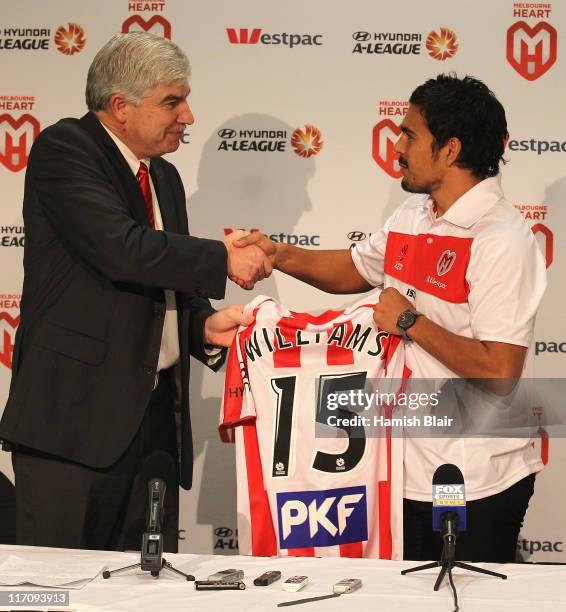 David Williams is welcomed by Melbourne Heart chairman Peter Sidwell during a press conference to announce his signing with A-League club Melbourne...
