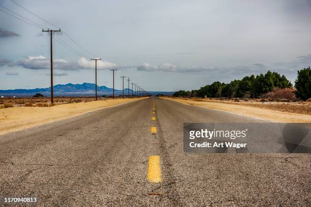 california desert road - utility pole stock pictures, royalty-free photos & images