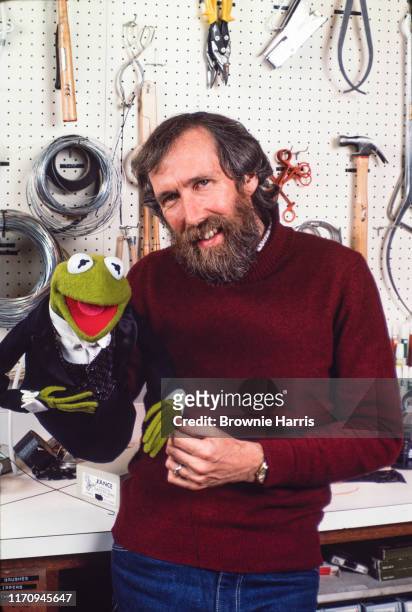 American puppeteer, inventor, and filmmaker Jim Henson with one of his creations, Kermit the Frog, New York, New York, 1983.