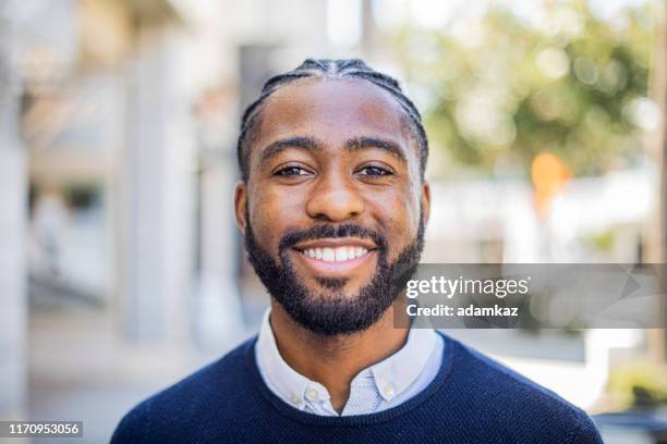 smiling black man - african cornrow braids stock pictures, royalty-free photos & images
