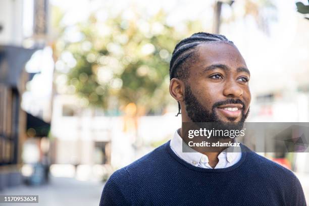confident young administrator - african cornrow braids stock pictures, royalty-free photos & images