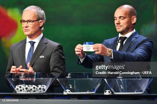 Wesley Sneijder draws out the name of Club Atletico de Madrid during the UEFA Champions League Draw, part of the UEFA European Club Football Season...