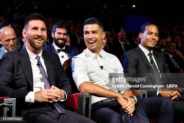 Cristiano Ronaldo of Juventus, Lionel Messi of FC Barcelona and Virgil Van Dijk of Liverpool react during the UEFA Champions League Draw, part of the...