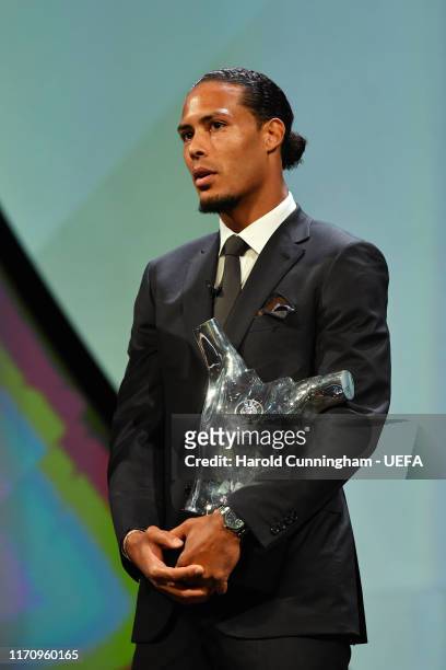 Virgil van Dijk of Liverpool looks on after being presented with the UEFA Men's Player of the Year 2018/19 Award during the UEFA Champions League...