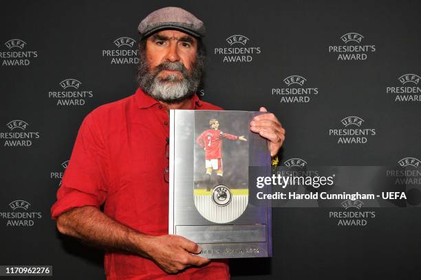 Eric Cantona pose for a photo with the UEFA 2019 President's Award following the UEFA Champions League Draw, part of the UEFA European Club Football...