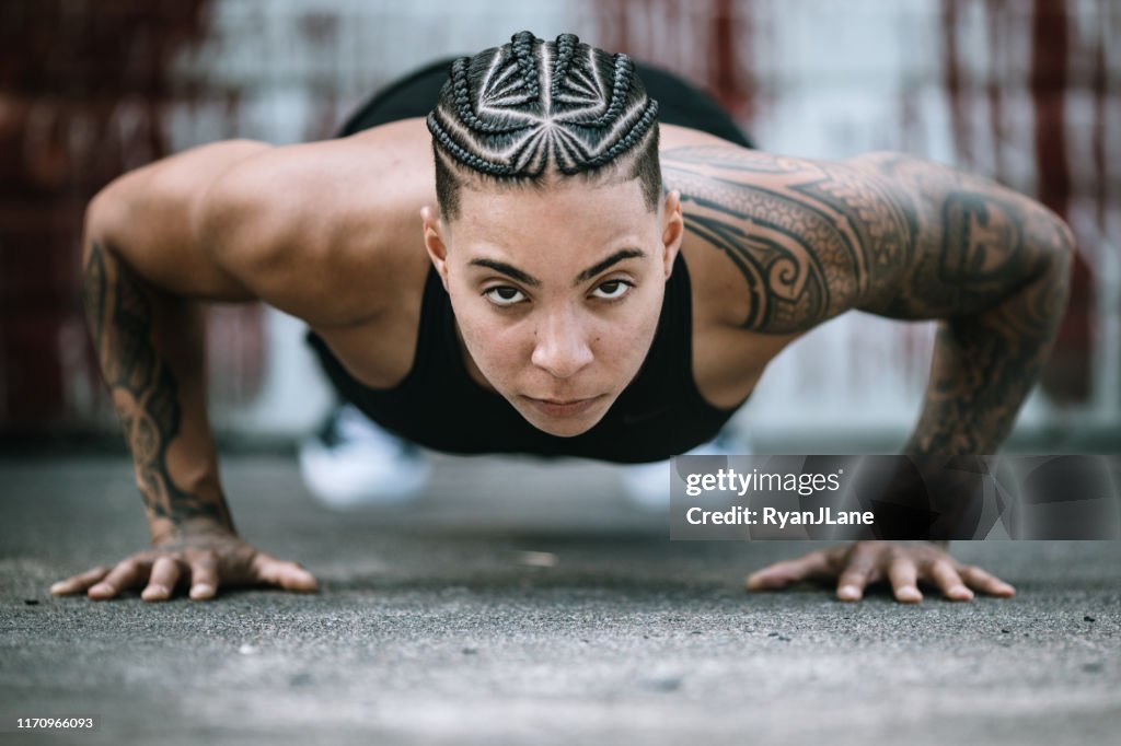 Strong and Fit Woman Working Out in Gym