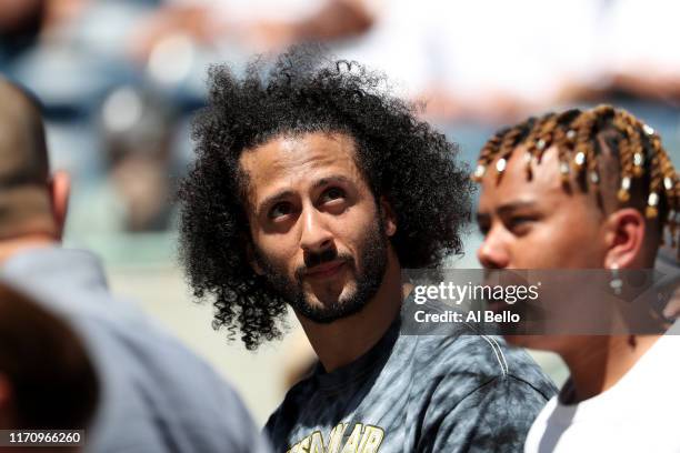 Former San Francisco 49er Colin Kaepernick watches a Women's Singles second round match between Naomi Osaka of Japan and Magda Linette of Poland on...