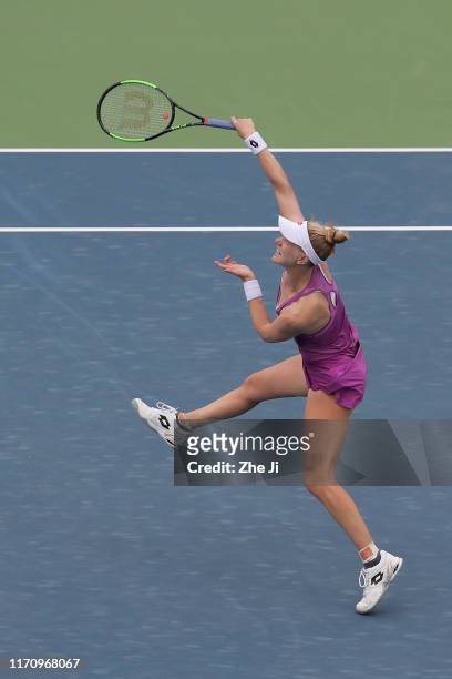 Alison Riske of the United States returns a shot during the match against Wang Qiang of China on Day 4 of 2019 Dongfeng Motor Wuhan Open at Optics...