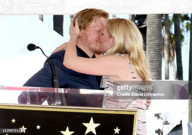 Jesse Plemons and Kirsten Dunst kiss during the ceremony honoring Kirsten Dunst with a star on the Hollywood Walk of Fame on August 29, 2019 in...