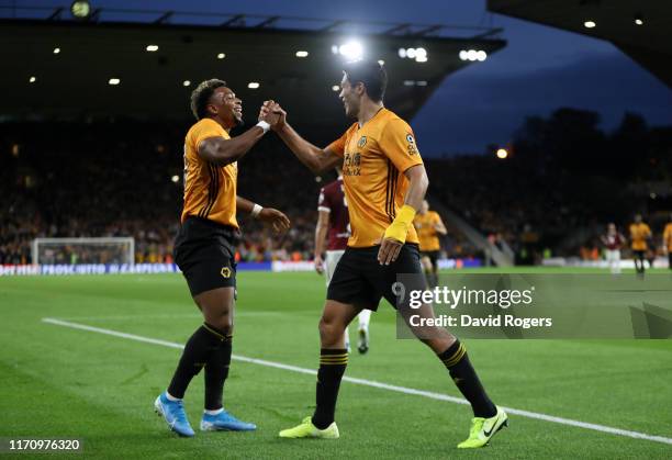 Raul Jimenez of Wolverhampton Wanderers celebrates with team mate Adama Traore after scoring his team's first goal during the UEFA Europa League...