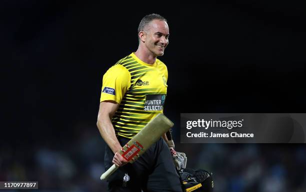 Michael Klinger of Gloucestershire Cricket celebrates his century as he walks off after the first innings during the Vitality Blast match between The...
