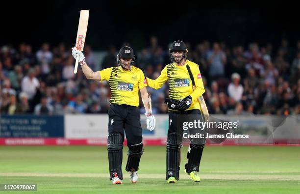 Michael Klinger of Gloucestershire Cricket celebrates his century with Jack Taylor during the Vitality Blast match between The Kent Spitfires and...