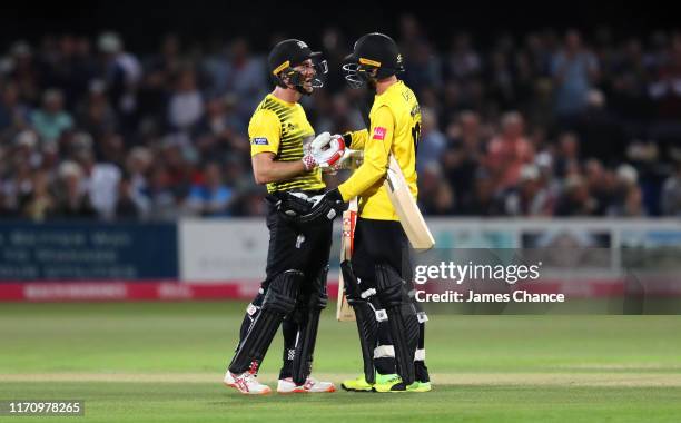 Michael Klinger of Gloucestershire Cricket celebrates his century with Jack Taylor during the Vitality Blast match between The Kent Spitfires and...