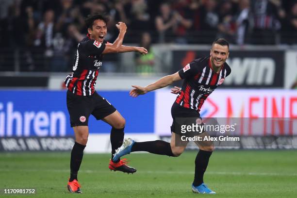 Filip Kostic of Frankfurt celebrates his team's second goal with team mate Makoto Hasebe during the second leg of the UEFA Europa League playoff...