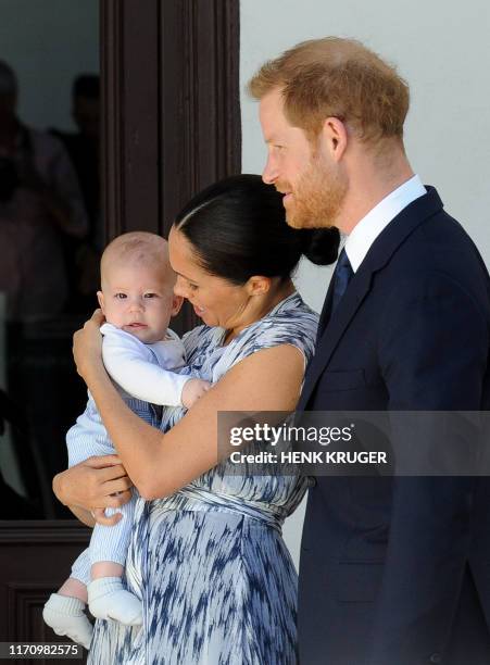 Britain's Duke and Duchess of Sussex, Prince Harry and his wife Meghan hold their baby son Archie as they meet with Archbishop Desmond Tutu and his...