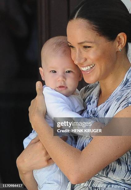 Britain's Duchess of Sussex Meghan, hold her baby son Archie as she and the husband meet with Archbishop Desmond Tutu and his wife Leah at the Tutu...