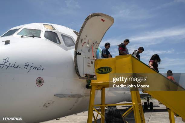 Families arrive on an ICE deportation flight from Brownsville, Texas on August 29, 2019 to Guatemala City. Under a new policy, ICE has expedited...