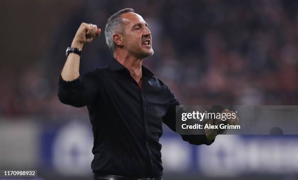 Head coach Adi Huetter of Frankfurt celebrates with the fans after the second leg of the UEFA Europa League playoff match between Eintracht Frankfurt...